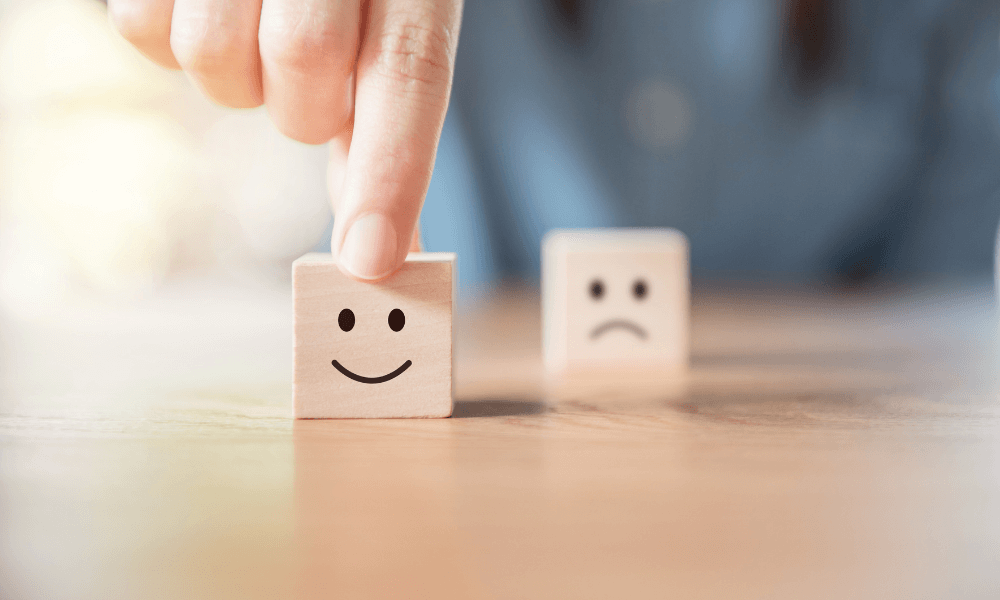 wooden blocks with happy and sad face