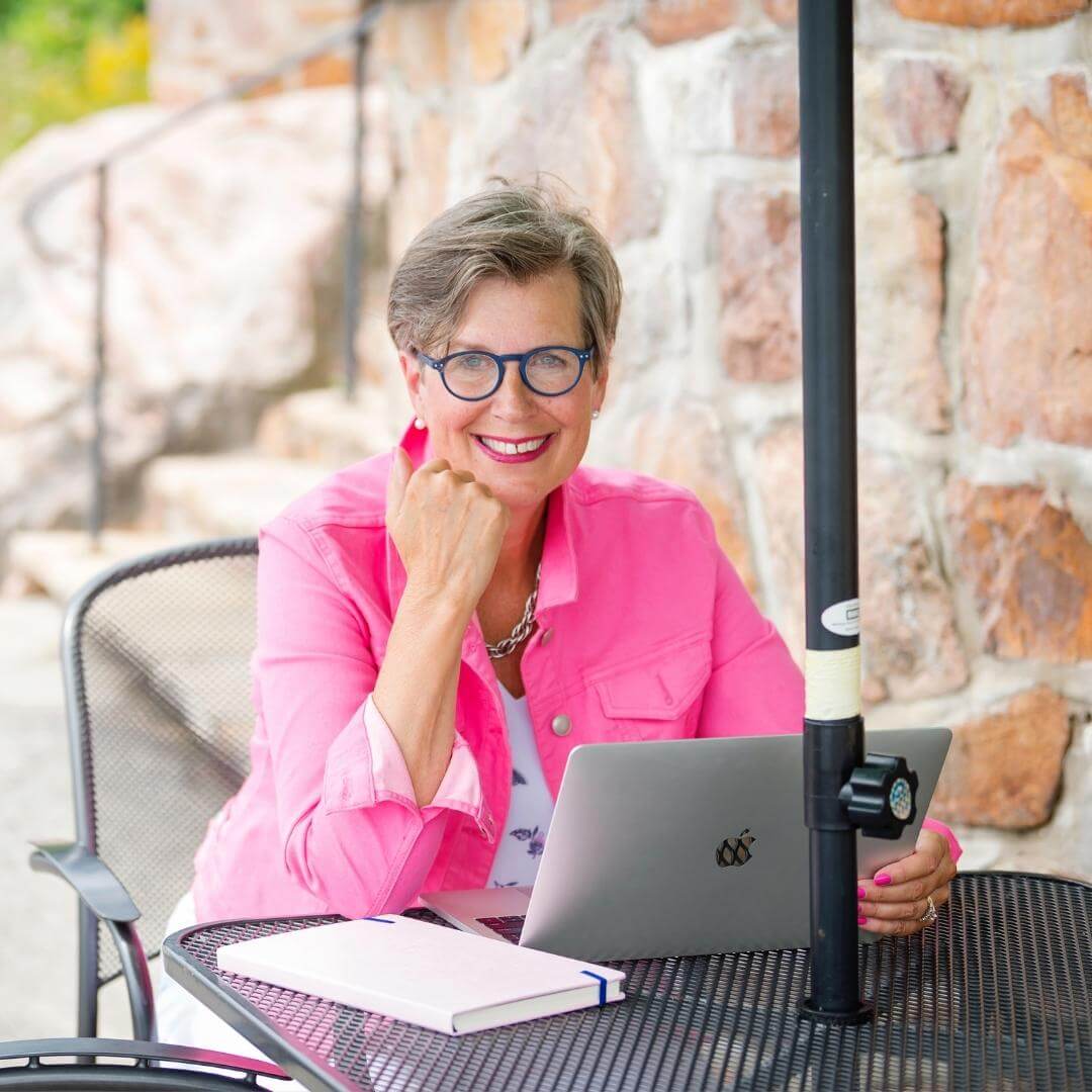 Diana Lidstone sitting in front of laptop