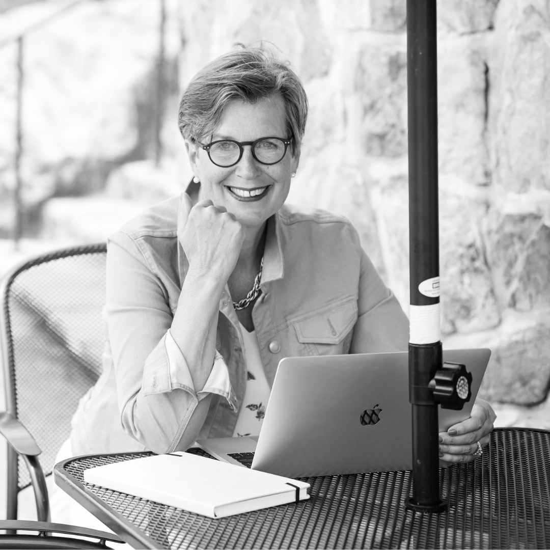 Diana Lidstone sitting in front of laptop